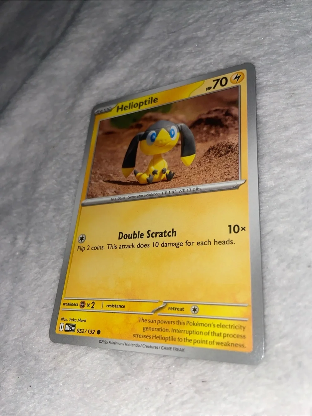 Helioptile Pokémon card (#052/132) from the Scarlet & Violet Prismatic Evolution